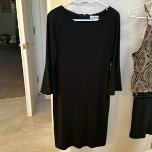 Calvin Klein longer dress, heavier polyester material. No snags, excellent shape
